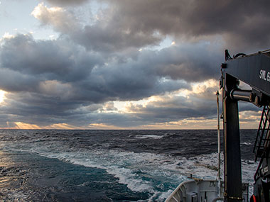 Sunrise over the back of NOAA Ship Okeanos Explorer.