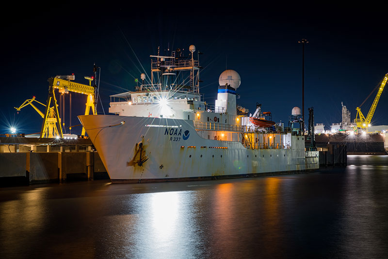 Image of NOAA Ship Okeanos Explorer in port at night.