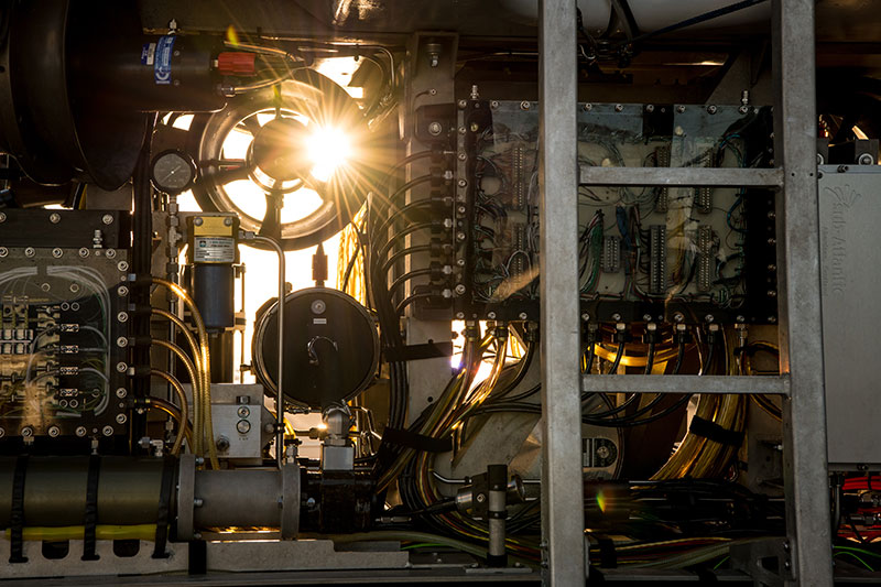 The inner workings of remotely operated vehicle Deep Discoverer at sunrise.