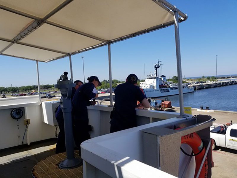 LT Abbitt conning NOAA Ship Okeanos Explorer for outbound transit from Singing River Island, Pascagoula, Mississippi, with her new Commanding Officer and Executive Officer.