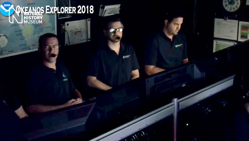 Karl McLetchie, Adam Skarke, and Michael White speaking live from Mission Control on Okeanos Explorer to the Attenborough Studio in London.