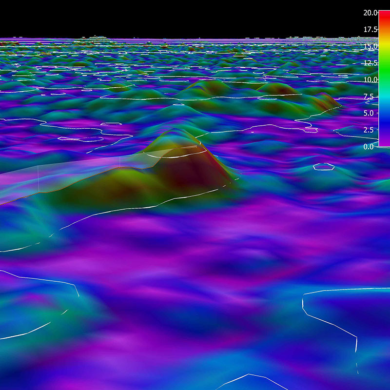 3D view of the planned ROV track for Dive 05 shown as orange line with white curtain protruding from the slope. The background represents the seafloor depth color-coded with slope in degrees. The warmer the color, the steeper the slope.