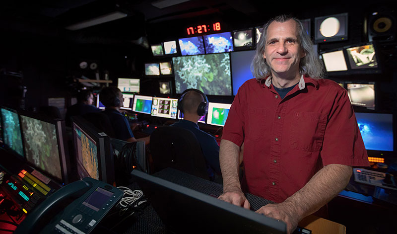 New Telepresence Coordinator for the NOAA Office of Ocean Exploration and Research, James Rawsthorne, working in the control room aboard NOAA Ship Okeanos Explorer while in the Atlantic Ocean for Windows to the Deep 2018: Exploration of the Southeast U.S. Continental Margin expedition.