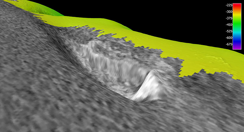 A three-dimensional view of the scour mark caused by a hard object on the seafloor as mapped by NOAA Ship Okeanos Explorer. The image shows the sonar reflection intensity (backscatter) in black and white, as draped over the topography of the seafloor. White indicates a strong reflection and hard substrate. The depth of this feature is 330 meters (1,083 feet). Though thought to possibly be a shipwreck, the bright mound ended up being a rocky reef habitat.