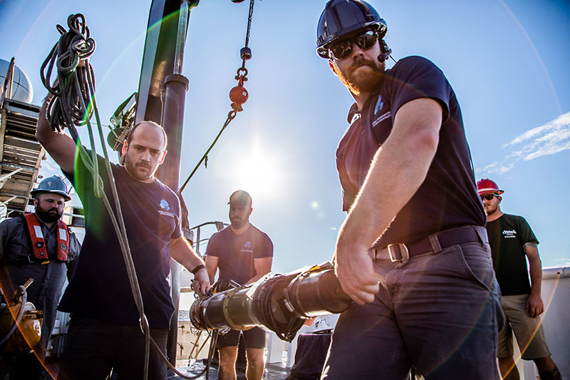 Preparing to deploy the USBL transponder. Image courtesy of Art Howard, GFOE, Exploring Deep-sea Habitats off Puerto Rico and the U.S. Virgin Islands.