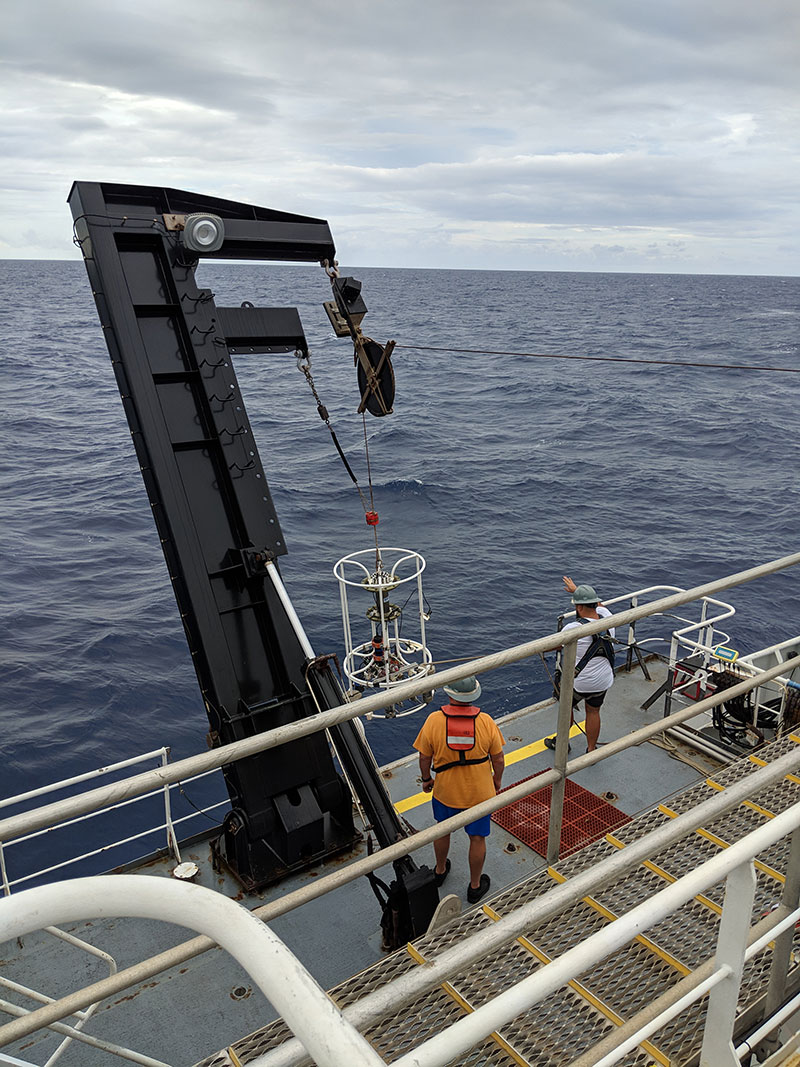 The CTD with attached housings and camera being lowered over the side to test the 3D printed pressure housings.