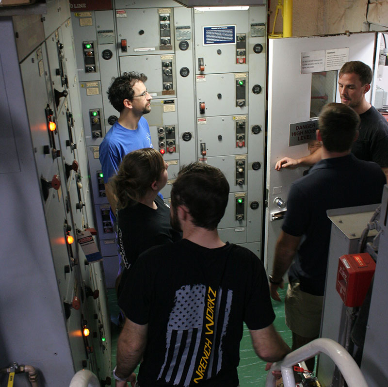 Warren shows the team through the engine room.