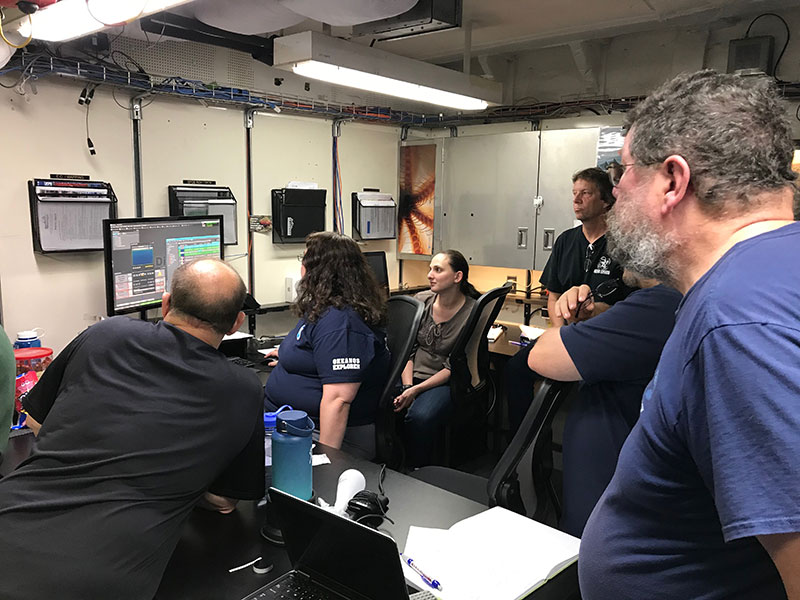 Members of the video and data team learn how to use a new system on board NOAA Ship Okeanos Explorer.