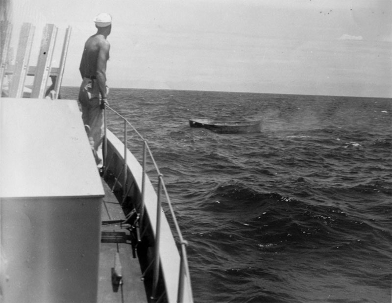 All of the survivors from the attack on the Bloody Marsh were rescued later in the morning by the Submarine Chaser (SC) 1049A. Here a crew member watches one of the lifeboats. Image courtesy of National Archives and Records Administration.