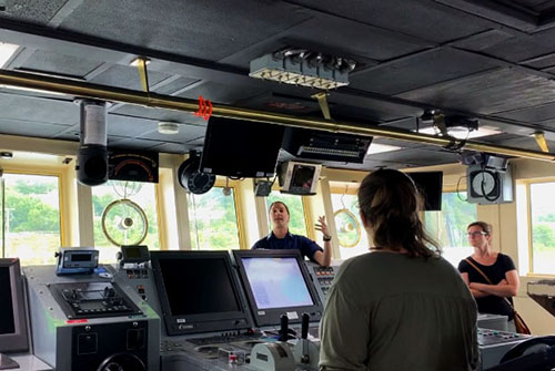 Operations Officer Lieutenant Rosemary Abbitt gives a tour of the bridge of NOAA Ship Okeanos Explorer during the August 23, 2019 ship tours in Dartmouth, Nova Scotia.