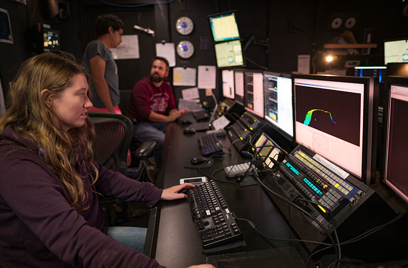 Mapping the ocean floor is the first step in exploring our ocean and is a key element of every NOAA Ocean Exploration expedition on NOAA Ship Okeanos Explorer. Here, a mapping watchstander in the ship’s control room edits multibeam data acquired during the 2017 Laulima O Ka Moana expedition. Image courtesy of NOAA Ocean Exploration, 2017 Laulima O Ka Moana.