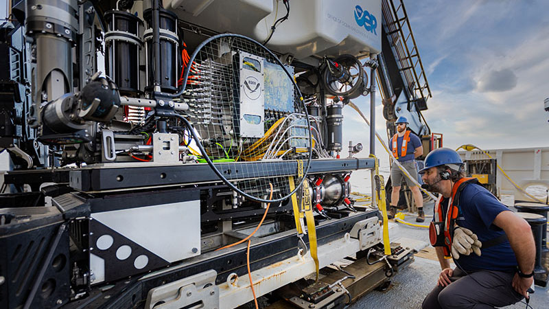 Engineers on deck prepare remotely operated vehicle Deep Discoverer for a dive during the 2022 ROV and Mapping Shakedown with the new “bioluminescence agitator” that was built to stimulate light production by animals in the deep, dark ocean.