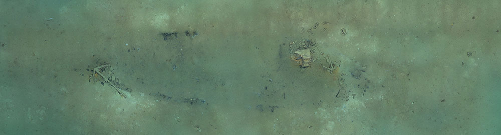 Extracted from a 3D model of the Industry shipwreck site explored during Dive 02 of the 2022 ROV and Mapping Shakedown, this photomosaic shows the ship’s remains and its outline in the sediment.