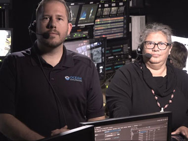 Expedition Coordinator Sam Cuellar and Mia Lopez in the control room of NOAA Ship Okeanos Explorer preparing for the first livestream event to acknowledge and honor the traditional stewards of the waters off the central California coast.