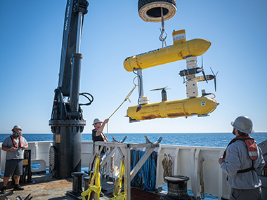 University of Southern Mississippi’s autonomous underwater vehicle Mola Mola being recovered after a dive by NOAA Ship Okeanos Explorer deck crew.