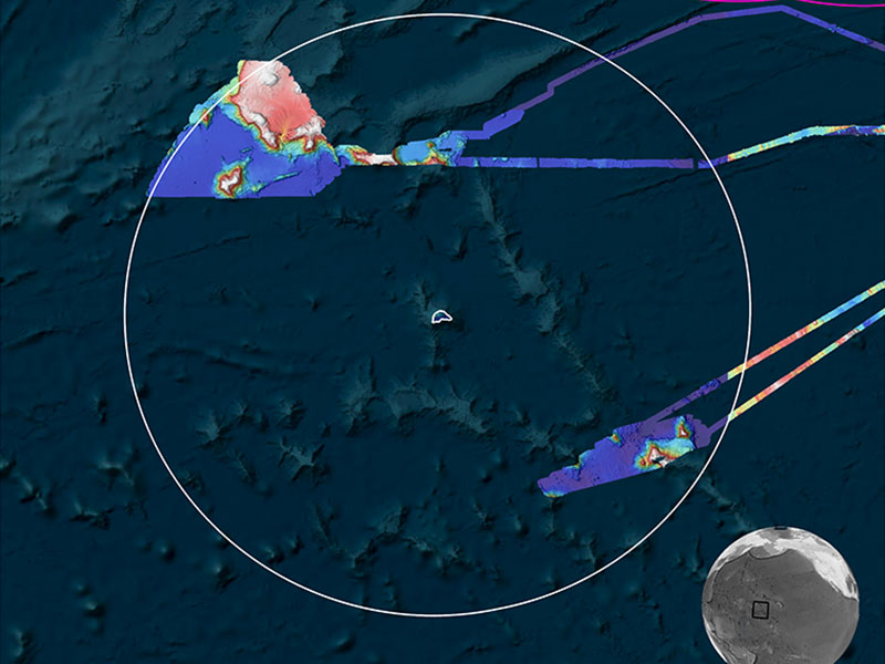 Map showing ocean topography with surveyed areas marked in varied colors and a white circle indicating a focus area. Includes NOAA logo, compass rose, and distance scale.