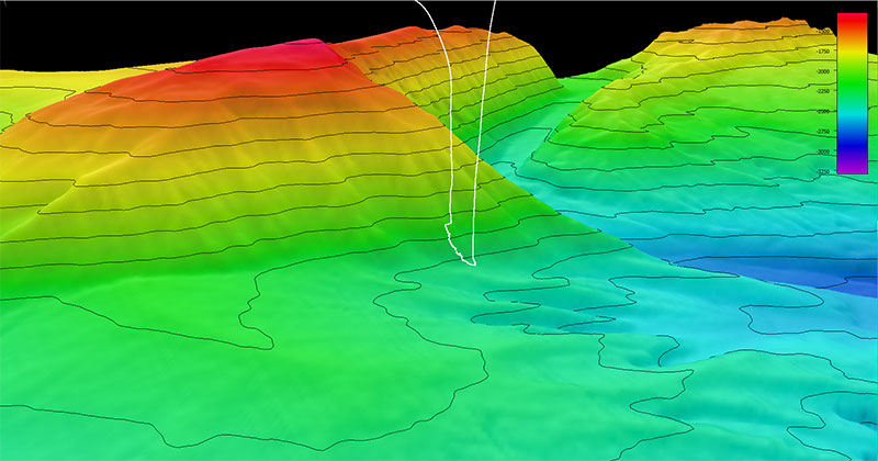 During the Seascape Alaska 3 expedition, the team mapped and thus discovered “Big Bend Canyon” and then explored part of the canyon during the second dive of the expedition. This image shows the dive track (white line) taken by remotely operated vehicles Deep Discoverer and Seirios during the dive overlain on collected multibeam bathymetry data with 100-meter (328-foot) contour intervals. Scale is water depth in meters.