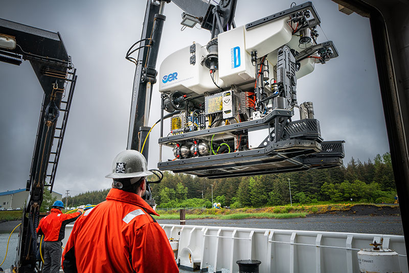 The team from the Global Foundation for Ocean Exploration prepare remotely operated vehicle Deep Discoverer for a 