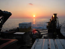 Image of sunset off the aft deck. image of sunset off the aft deck