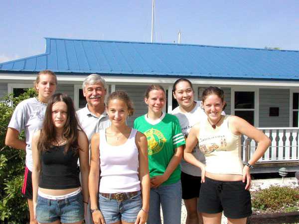 Girl Scouts pose with sancuarty superintendent Billy Causey.