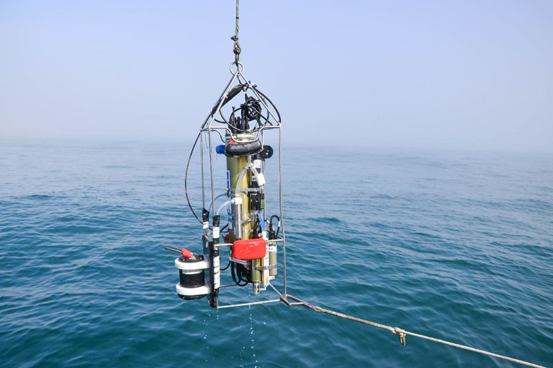 A conductivity temperature depth (CTD) device is cast behind the boat during the Coordinated Simultaneous Physical-Biological Sampling Using ADCP-Equipped Ocean Gliders expedition. This instrument can measure oceanographic properties to help scientists learn more about the marine environment. This particular CTD is also outfitted with an acoustic Doppler current profiler (ADCP) to survey biological organisms in the water column like zooplankton and small fish.