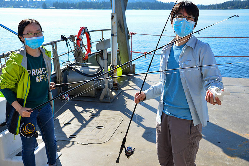 Gone fishing? Not quite. Coordinated Simultaneous Physical-Biological Sampling Using ADCP-Equipped Ocean Gliders expedition principal investigator Wu-Jung Lee and research assistant Linda Nguyen set up for transducer calibration. Using fishing rods, a calibration sphere of known density will be suspended below the boat’s transducer to make sure echosounder data is accurate. Oftentimes, scientists must get creative with the tools they have to accomplish their research objectives! 
