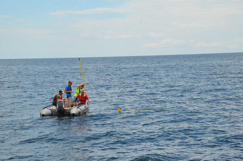 The glider team on the small boat deploying the glider.