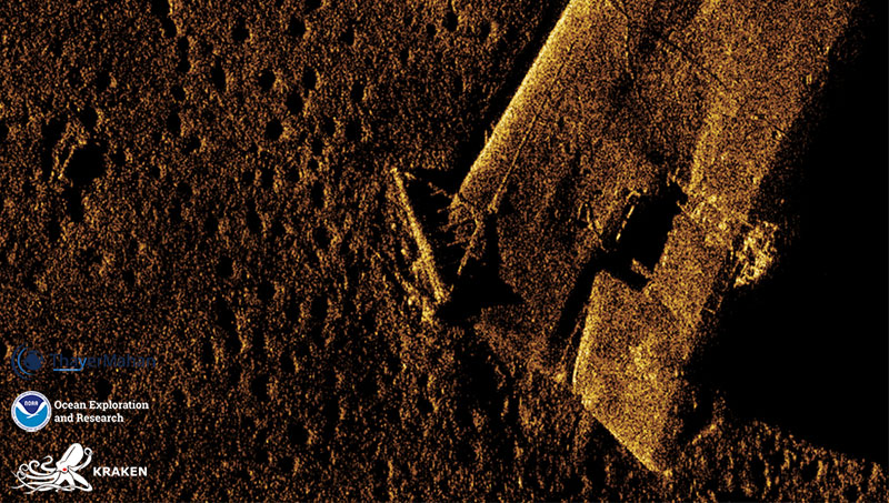 Close-up synthetic aperture sonar image of the bow section of the USS Murphy.  This type of bottom dredge is commonly used in commercial bottom fishing industry for scallops, oysters, clams and other bottom dwelling species.  The front part of these dredges are typically made of a metal towing bail that is weighed down, seen here caught on the bow of the Murphy. The dredge is dragged along the seafloor and is attached dot a series of chains and nets to mobilize and hold the catch.