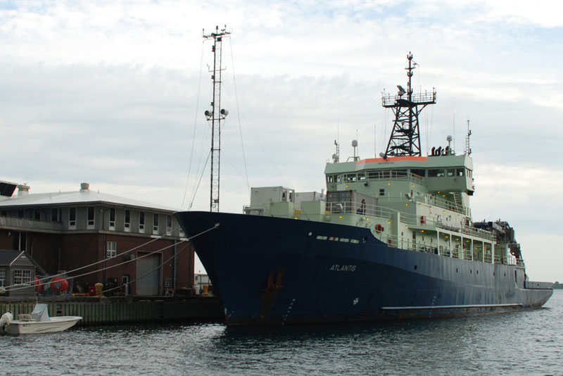 The R/V Atlantis docked at its home port at the Woods Hole Oceanographic Institution in Woods Hole, Massachusetts. Image courtesy of DEEP SEARCH 2018 - BOEM, USGS, NOAA.