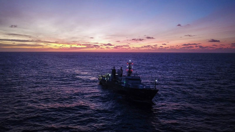 R/V Falkor in the Phoenix Islands Protected area – where the closest human neighbors are on the space station. Image courtesy of Schmidt Ocean Institute.