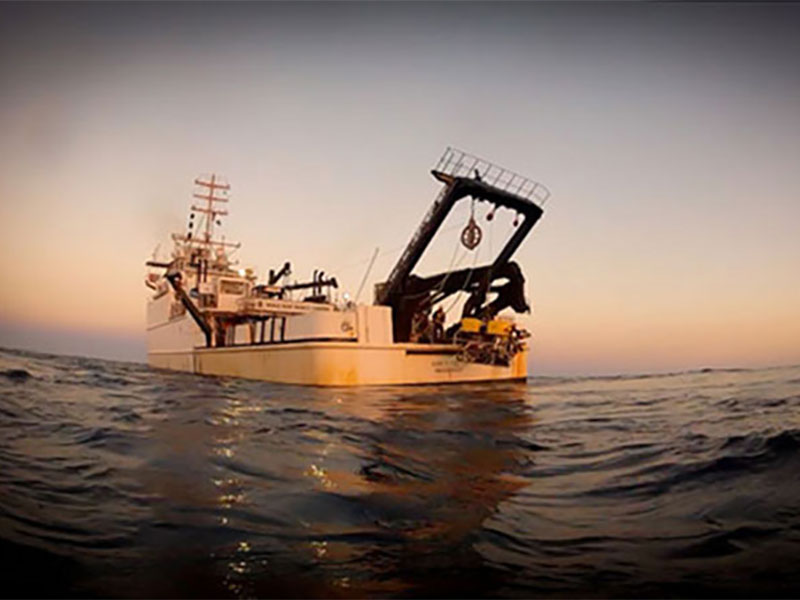 The remotely operated vehicle Kraken II being retrieved on Nancy Foster at sunset. Image courtesy of A. Howard, Deepwater Canyons 2012 Expedition, NOAA-OER/BOEM.