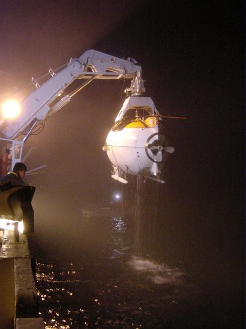 As the Mir is recovered, water drips from its hull in preparation for returning to the Keldysh.