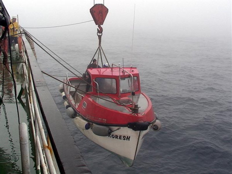 The work boat Koresh and her crew are launched over the side of the Keldysh in order to aid in the deployment of the Mir submersibles.