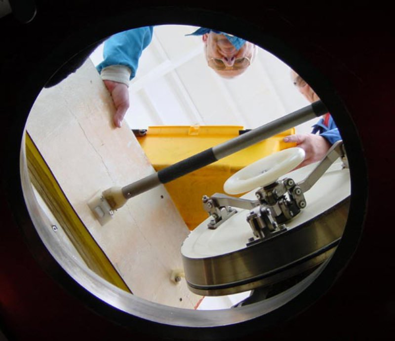 Chief submersible pilot Anatoly Sagalevitch climbs into the Mir submersible.