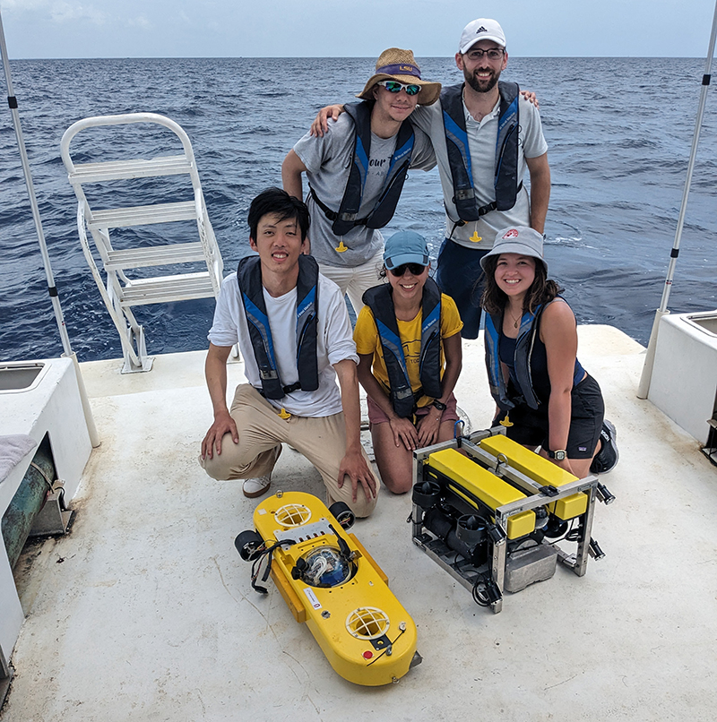 Team members with DROPSphere (left) and Bruce (right) underwater vehicles.