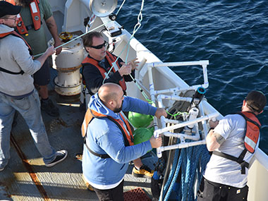 The Maka Niu camera module and light module, attached to one of the tested PVC configurations, are brought back on board by the crew of NOAA Ship Okeanos Explorer during the 2023 EXPRESS: West Coast Exploration (AUV and Mapping) expedition.